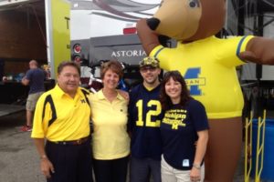 Family photo with their favorite team- Go Blue