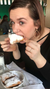 Brianna eating a beignet in New Orleans