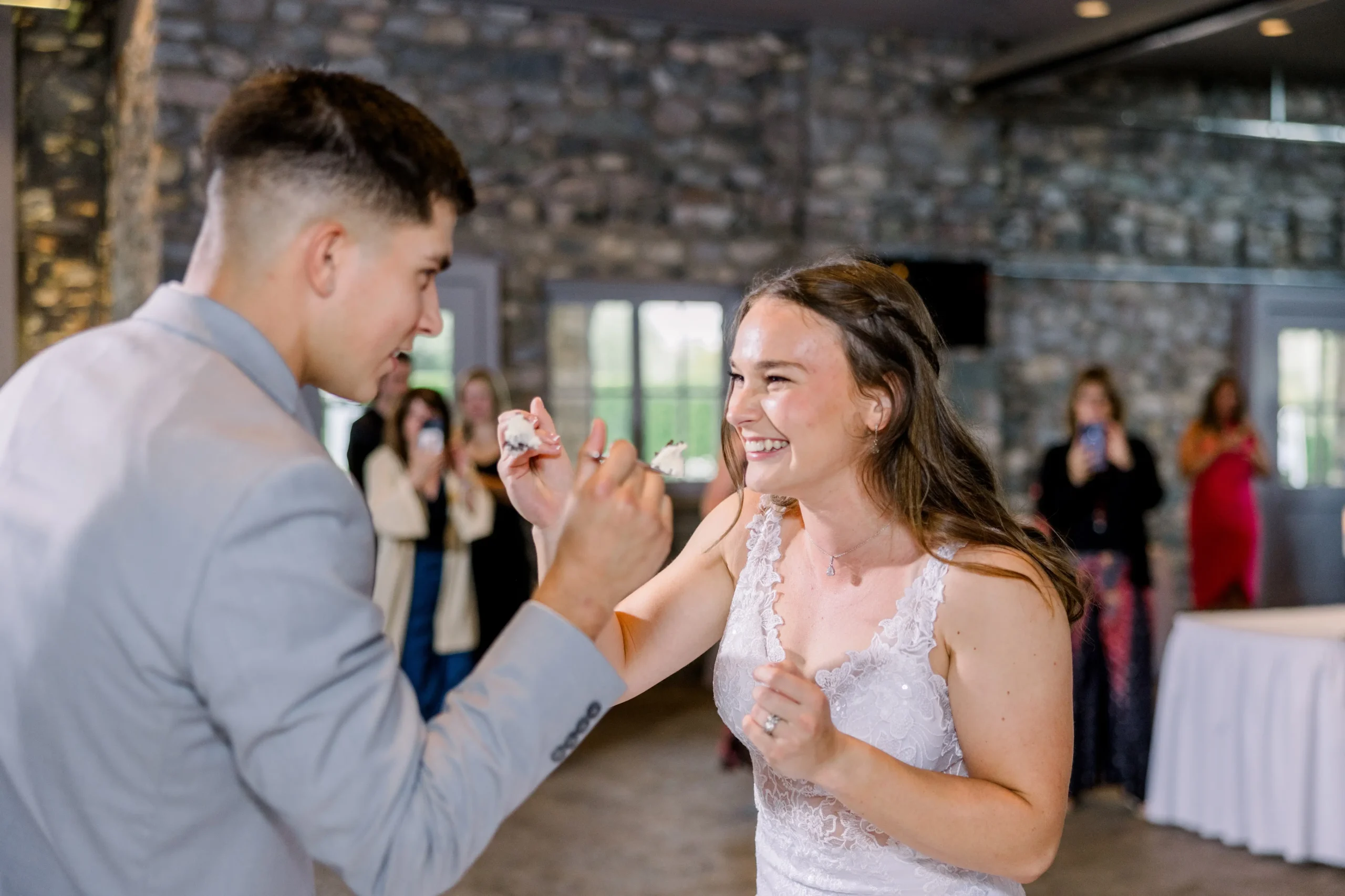 Bride and Groom sharing cake by Mandie Forbes Photos & Film