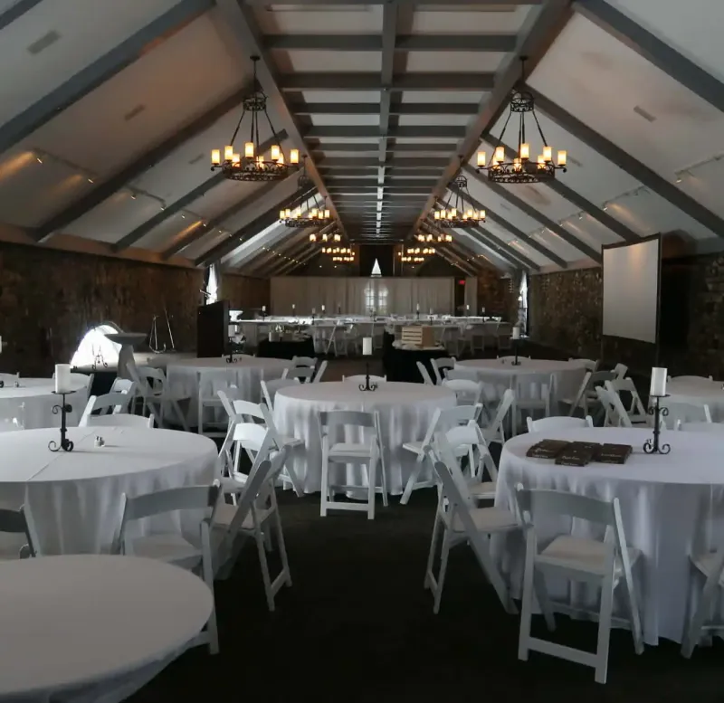 Event space with tables and chairs at Castle Farms