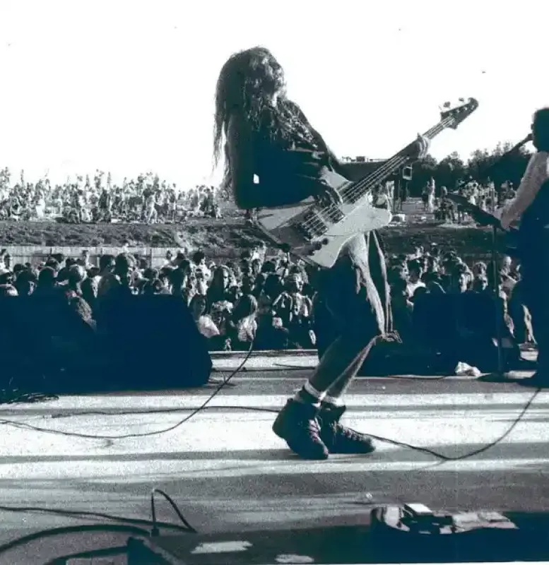 A rock star with an electric guitar on a stage at Castle Farms.