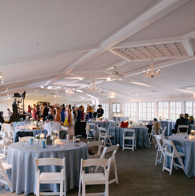An entrance of a garden-style wedding reception space