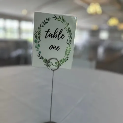 A table marker reading "Table One" on a table at Castle Farms.