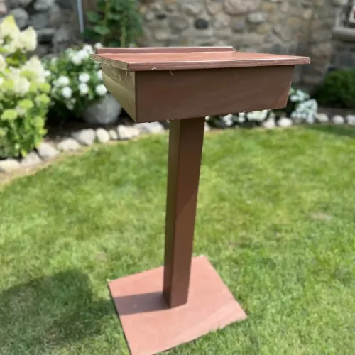A wooden podium on grass at Castle Farms.