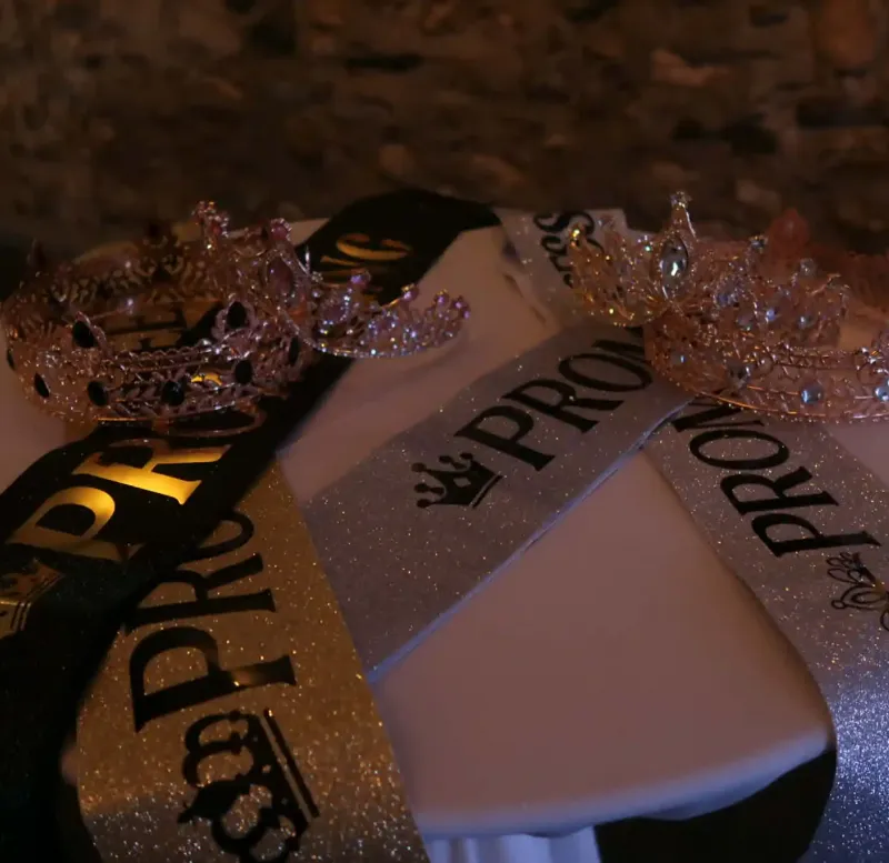 Prom sashes on a table at an event at Castle Farms