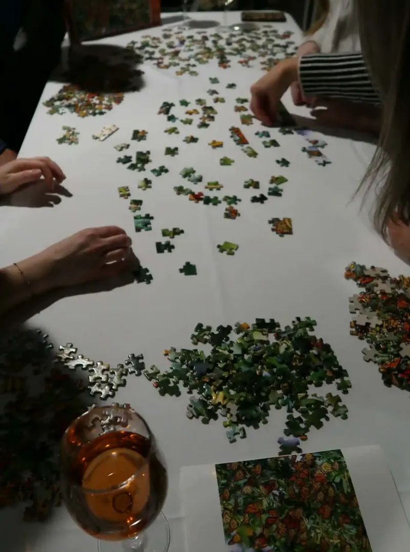 A puzzle scattered on a white table at the pub at Castle Farms. 