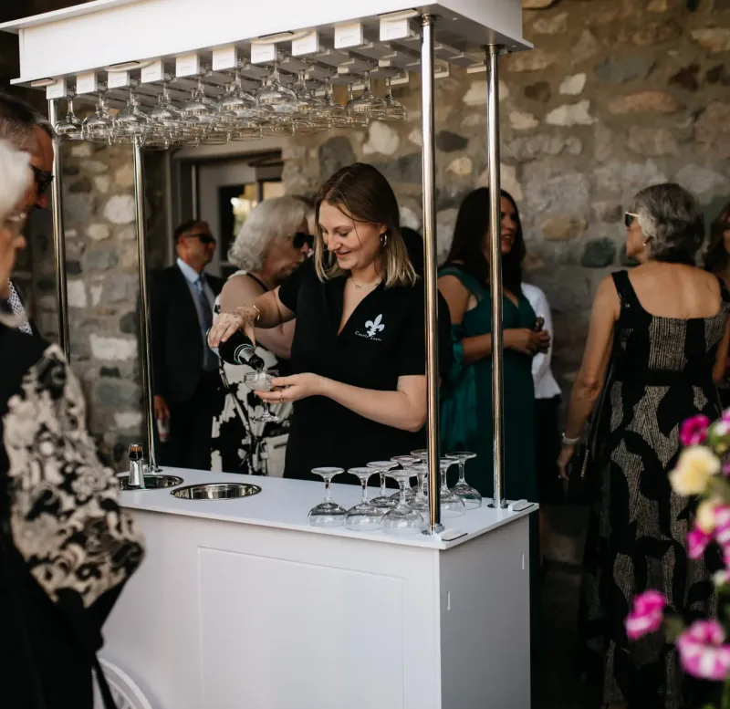 A bartender serving drinks to guests at a wedding reception at Castle Farms.