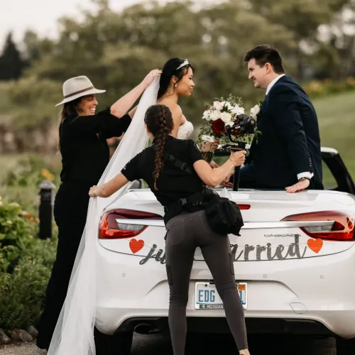 Castle Farms venue coordinator assisting newlyweds after their wedding ceremony