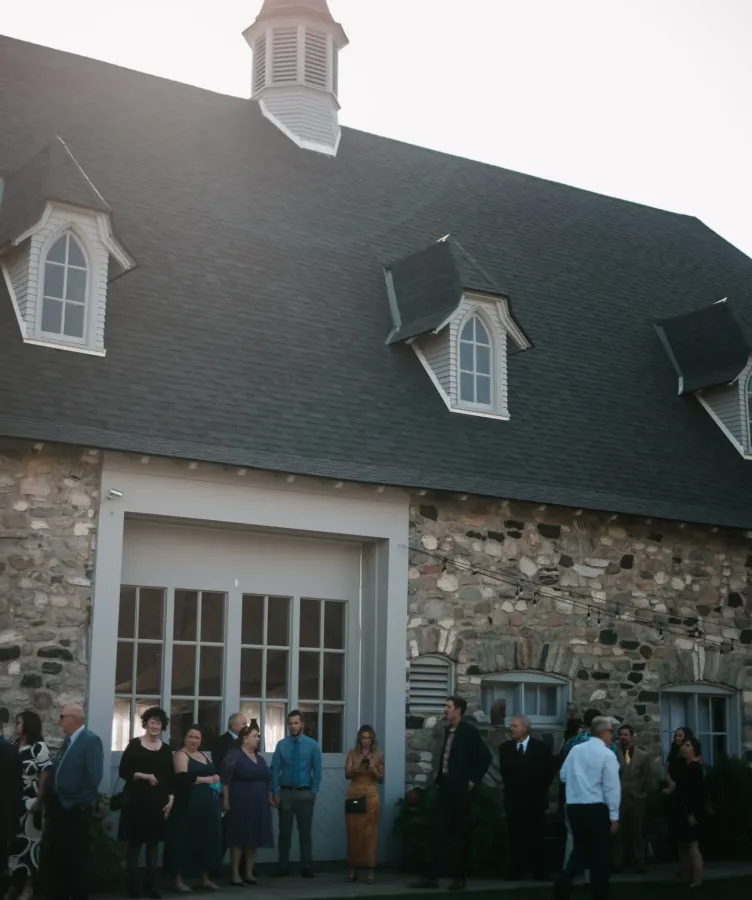 People standing outside a building at Castle Farms
