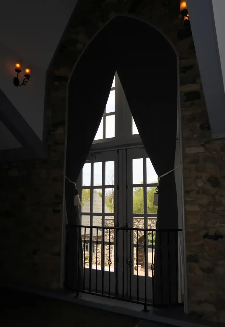 A Grand Reception Beneath Iron Chandeliers at Castle Farms