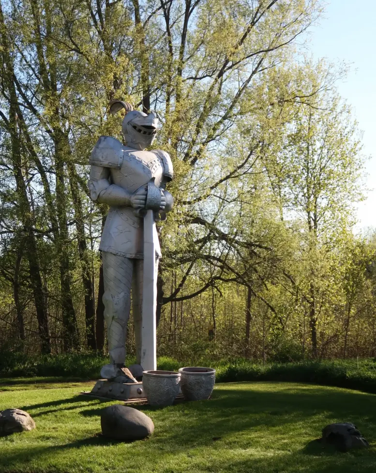 A tall knight's armor overlooking the grounds of Castle Farms.