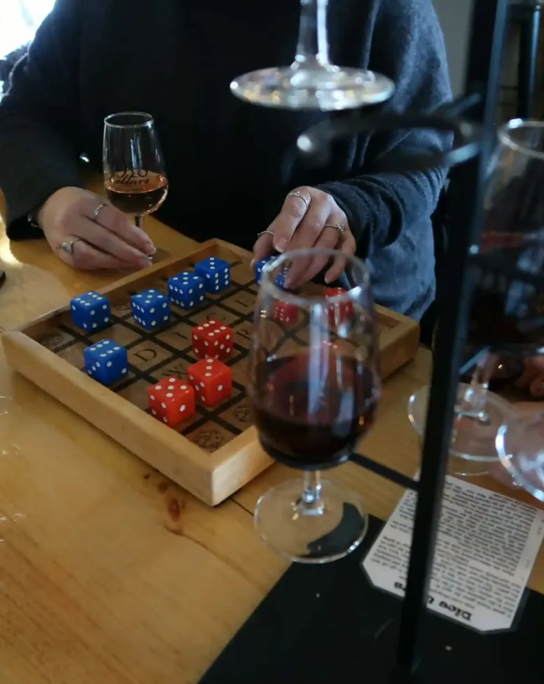 People playing dice games at a table at Castle Farms. 