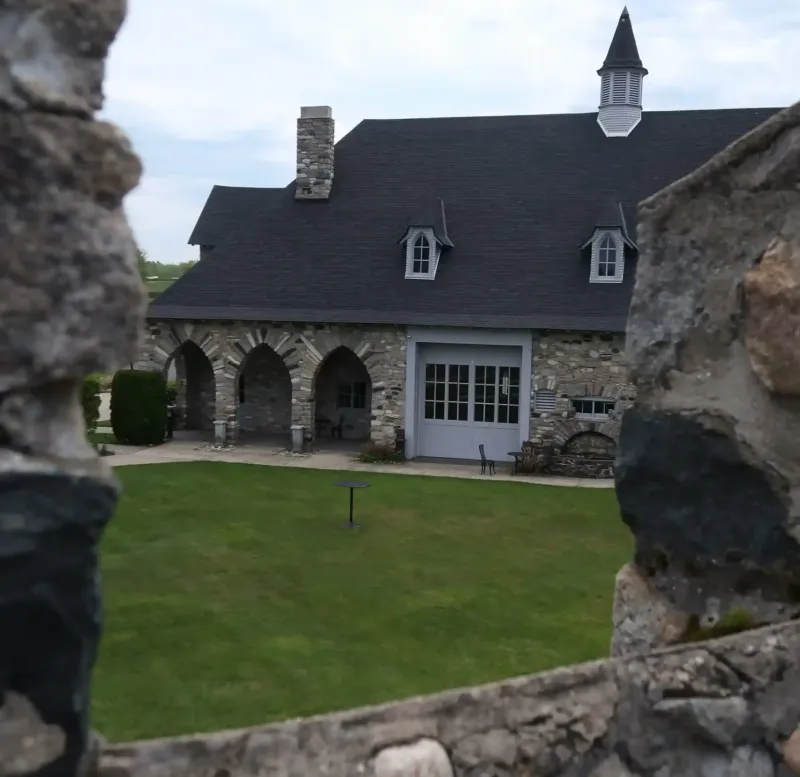 A view of a building and lawn from a tower at Castle Farms.