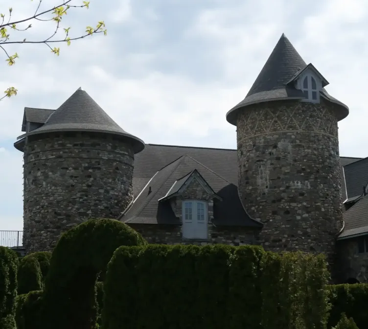 A castle behind hedges at Castle Farms.