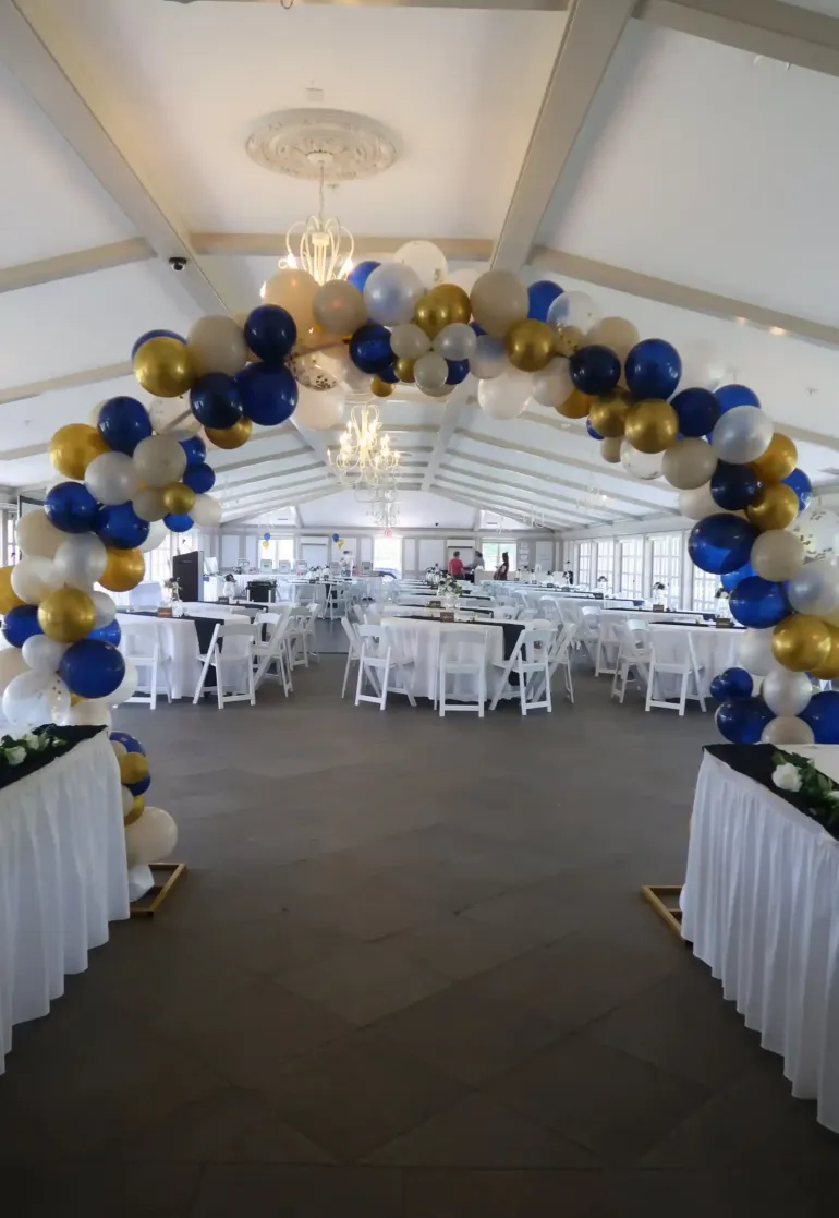 An arch of balloons at an entrance to an event space at Castle Farms. 