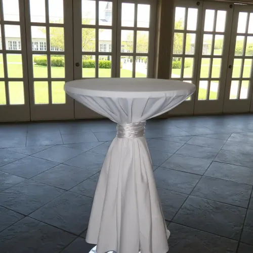 A floor-length linen cocktail table at Castle Farms.