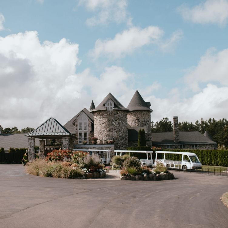 A trolley shuttles people around a corner of the gardens of Castle Farms.
